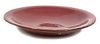 A Red Glazed Ceramic Charger Diameter 20 inches.
