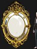 A Monumental French Hand Curved Wood Figural Mirror