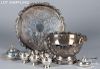 Large group of silver plated serving pieces.