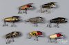 Eight Heddon crazy crawler wood fishing lures, to include a chipmunk pattern, longest - 2 3/4''.