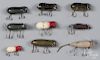 Seven Shakespeare wood mouse fishing lures, together with a Heddon 210 surface lure in mouse pattern