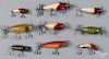 Six South Bend wood Surf Oreno fishing lures, together with a Lil Rascal, Dive Oreno and a Tease-ore