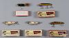Five Heddon wood fishing lures in boxes, to include two 150 Dowagiac minnow, two Vamps, and a Weedle