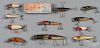 Ten Shur Strike wood fishing lures, in the original box, together with a Lucky Strike jointed pike,