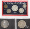 Two silver Peace dollars, together with three US silver Celebration sets.