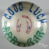 Three colored frit Good Luck paperweight, with a horseshoe on a white ground, 3 1/4'' dia.