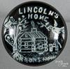 White frit Lincoln's Home paperweight, with a log cabin on a dark green ground, 3 7/8'' dia.