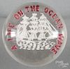 Two - color frit paperweight, with a white sailing ship, inscribed A Life On The Ocean Wave, 3 5/8