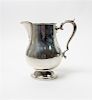 * An American Silver Water Pitcher, M. Fred Hirsch Co., Jersey City, NJ, of baluster form, raised on a circular foot.