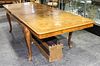A Queen Anne Style Burlwood Dining Table Height 29 1/2 x width 66 x depth 41 1/2 inches.