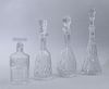 WATERFORD CUT-GLASS DECANTER AND STOPPER AND THREE OTHER DECANTERS AND STOPPERS