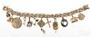 14K yellow gold charm bracelet, with assorted charms, 48.2 g.