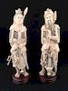 An antique pair of finely carved warriors, each on a round carved wood base.<BR>He