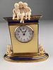 Cartier figural desk clock with three young children on the very top and another