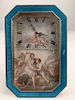 Enameled silver clock decorated with young winged children and two adults with t