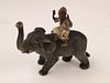 Antique cold painted vienna bronze of a man ridding on the back of an elephant