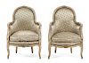 A Pair of Louis XV Style Painted and Gilt Bergeres Height 34 7/8 inches.