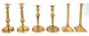 Three Pairs of Continental Gilt Metal Candlesticks Height of tallest 11 1/4 inches.