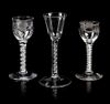 A Group of Three English Glass Wine Goblets Height of tallest 6 3/8 inches.