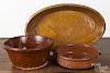 Three redware baking dishes, largest - 10'' h., 16 3/4'' w.