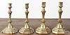 Pair of French engraved brass candlesticks, late 18th c., together with a similar pair, 9 1/4'' h. an