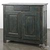 Continental painted pine cupboard, late 18th c., retaining an old blue surface, 38 1/4'' h., 38 1/4''