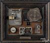 Framed disassembled Brownie Movie Camera, titled Boy, Was She Ugly!, with brass plaque, inscribed