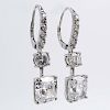 GIA Certified Approx. 7.07  Carat TW Cushion Cut Diamond and 18 Karat White Gold Pendant Earrings Accented with Round Brillia
