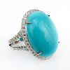 Contemporary Oval Cabochon Turquoise, 1.05 Carat Round Brilliant Cut Diamond and 18 Karat White Gold Ring.