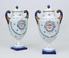 PAIR OF CHINESE EXPORT PORCELAIN STYLE PISTOL-HANDLED URNS AND COVERS