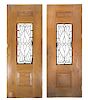 A Pair of Oak Swinging Three Panel Doors Height 93 1/2 x width 35 x depth 1 3/4 inches.