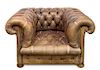 A Leather Upholstered Chesterfield Armchair Height 26 inches.