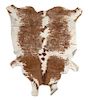 A Cow Hide Rug. Length approximately 90 inches.