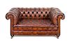 A Leather Upholstered Chesterfield Sofa Height 28 x width 66 x depth 37 inches.