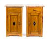 A Pair of American Maple Bedside Cabinets Height 27 1/2 x width 16 1/2 x depth 14 1/2 inches.