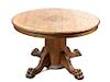 A Victorian Oak Extension Table Height 28 1/2 diameter 47 inches (closed).