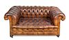 A Leather Upholstered Chesterfield Loveseat Height 29 x width 64 x depth 36 inches.