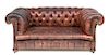 A Leather Upholstered Chesterfield Loveseat Height 28 x width 64 x depth 36 inches.
