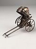 Antique Chinese minature rickshaw with rolling wheels and collapsible top.