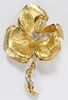 18KT YELLOW GOLD AND DIAMOND FLORAL BROOCH