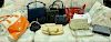 Lot of fourteen womens purses, handbags, and clutches.