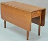 Federal mahogany drop leaf table with one drawer. ht. 29in., wd. 18in., dp. 47in.