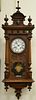 Vienna regulator clock with enameled dial. ht. 48in., wd. 16in.
