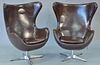 Pair of swivel egg chairs, Arne Jacobsen style, adjustable.