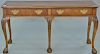 Baker mahogany server/hall table with ball and claw feet. ht. 28in., top: 16" x 54"