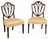 Pair of Hepplewhite mahogany shieldback dining chairs, ca. 1795.