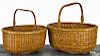 Two nesting Nantucket oval lightship baskets, early/mid 20th c., attributed to Mitchell Ray, 5 3/4