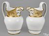 Pair of Philadelphia Tucker porcelain pitchers, ca. 1825, with gilt decoration and a tan band unde