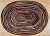 Large braided oval rug, 20th c., 12' x 8' 6''.