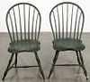 Pair of Pennsylvania painted bowback Windsor chairs, late 18th c., retaining an old green surface.
